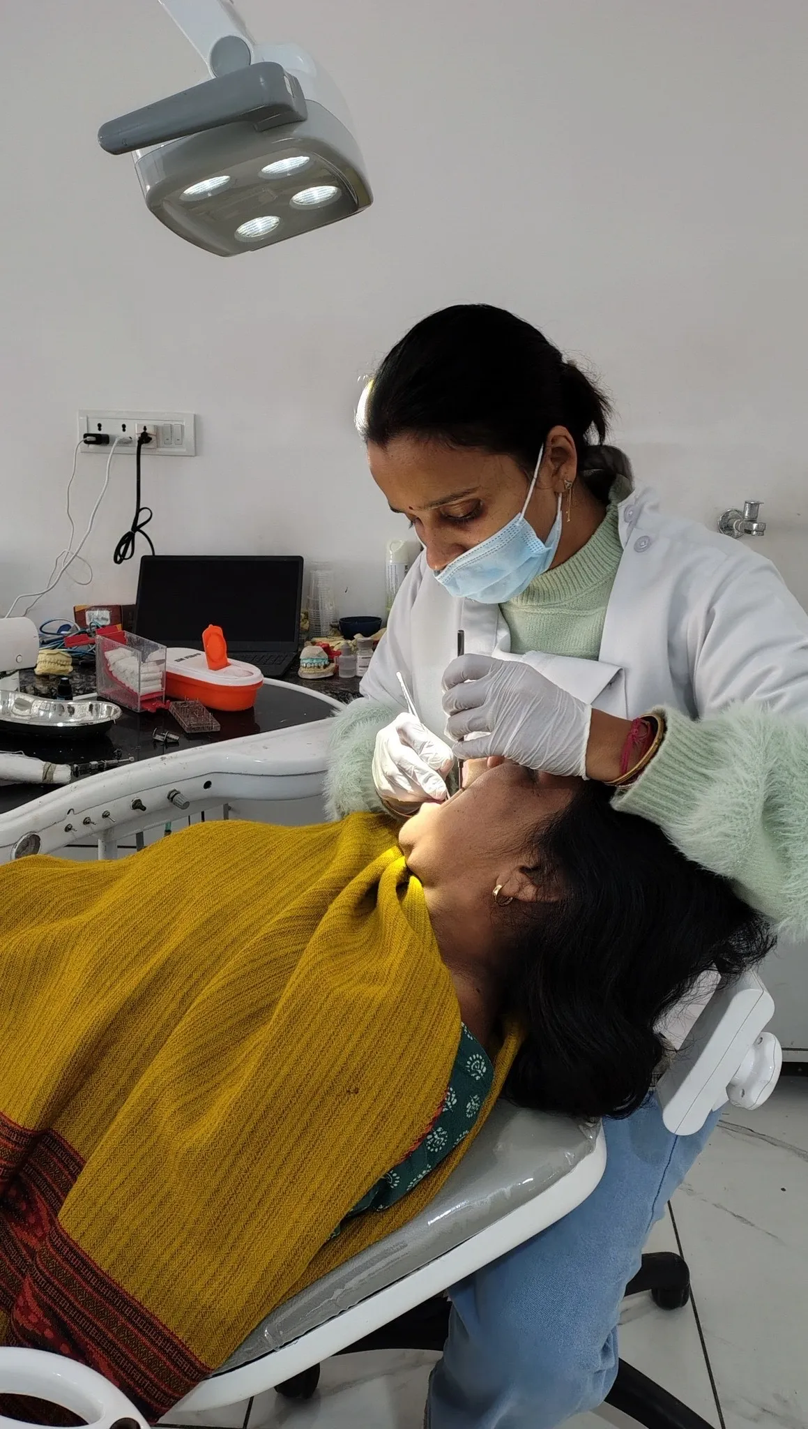 Dr. Yuvika Garg treating a patient at Garg Dental Clinic